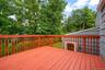 Kitchen door to the deck makes kitchen-level grilling, al fresco dining...