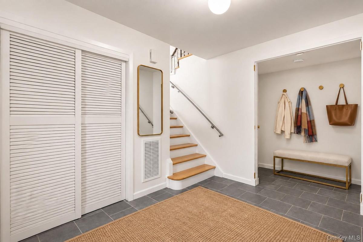 Step inside to a spacious, newly tiled foyer.