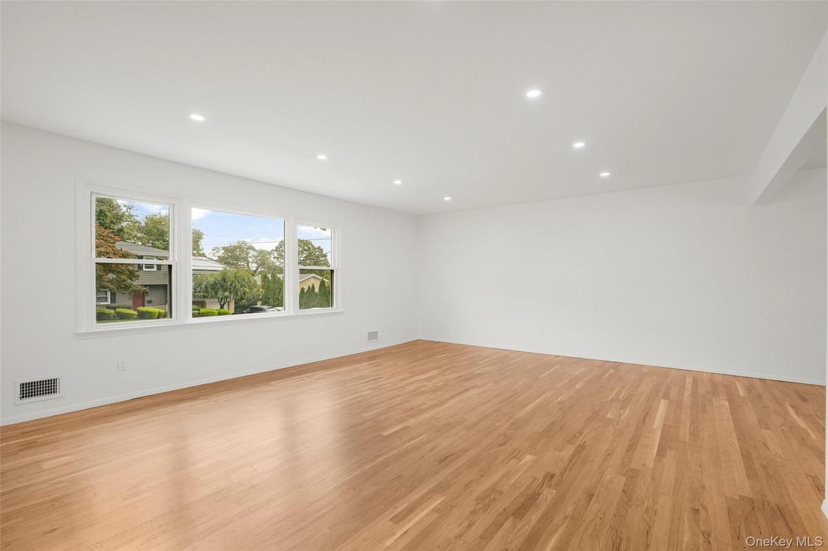 Freshly refinished original hardwood floors bring warmth and character.