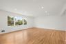 Freshly refinished original hardwood floors bring warmth and character.