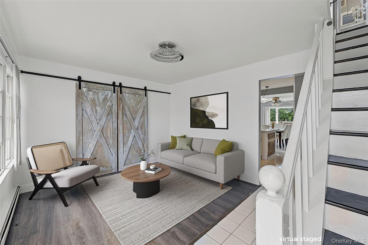 Virtually Staged Living Room view from front door entry