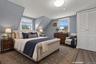 Virtually staged view of fourth bedroom located on second floor