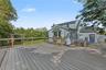 Expansive outdoor deck with wood railing