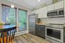 Granite and butcher block counters. Large windows and stainless steel appliances.