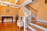 A grand original stair case with a unique design graces the foyer