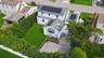 Expansive backyard with a composite deck, and mature privacy landscaping