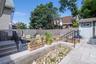 Fenced backyard with upper and lower patios.  Shed on upper level