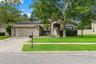 Attractive single-story curb appeal, mature landscaping, and a two-car garage welcome you home.