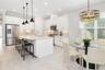 The kitchen area is highlight by designer lighting fixture