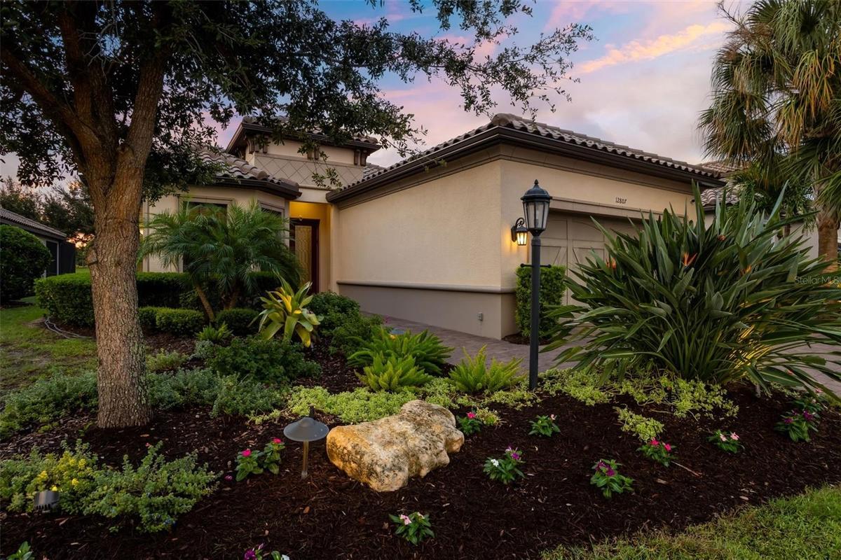 Lush, professionally landscaped front yard