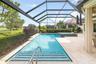 Landscaping surrounds the pool