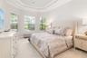 The primary bedroom features beautiful tray ceilings with crown molding and a three bedroom bay window area.  Bedroom easily accommodates a king-size 