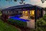 The surface of the lanai is sealed Travertine rectangular pavers of various sizes