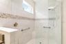 Primary shower is large and  the window provide natural light