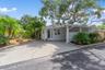 Covered Carport and Driveway accommodates up to 3 Vehicles
