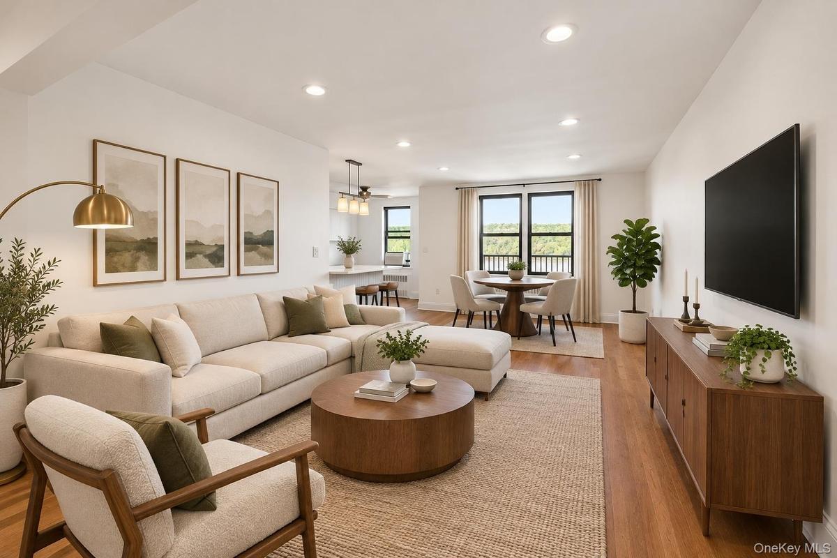 Spacious living room with recessed lighting and stunning view! (virtually staged)