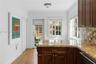 Kitchen offers space for breakfast nook and convenient laundry closet