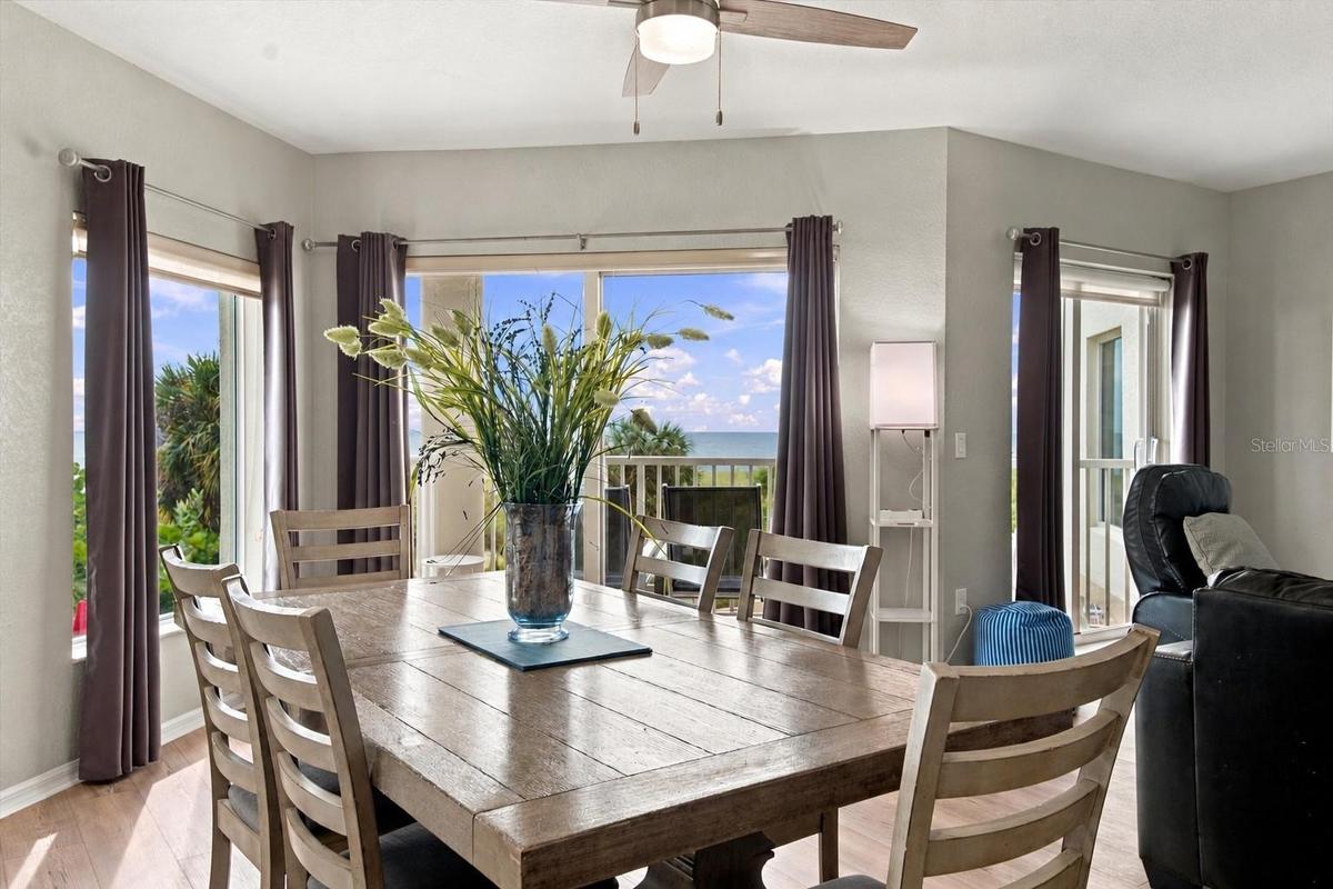 Generous Dining Area with Ample Seating and Gulf of Mexico Views in the Background