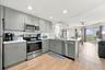 Updated Kitchen with Quartz Countertops, Stylish Backsplash, LVP Flooring and Gulf Views
