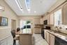 Open updated kitchen with skylights and access to side deck