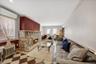 generous living room with wood burning stone fireplace