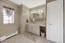 Grand spa full bath with linen closet on second floor