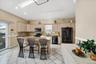 spacious updated kitchen with center island, skylights and access to outside deck
