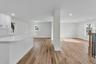 Kitchen Island - Dining Area and Living Room - Entry from right of railings