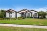 Welcome home to 6402 Rubia Circle in Andalucia, a beautiful gated community in Apollo Beach!