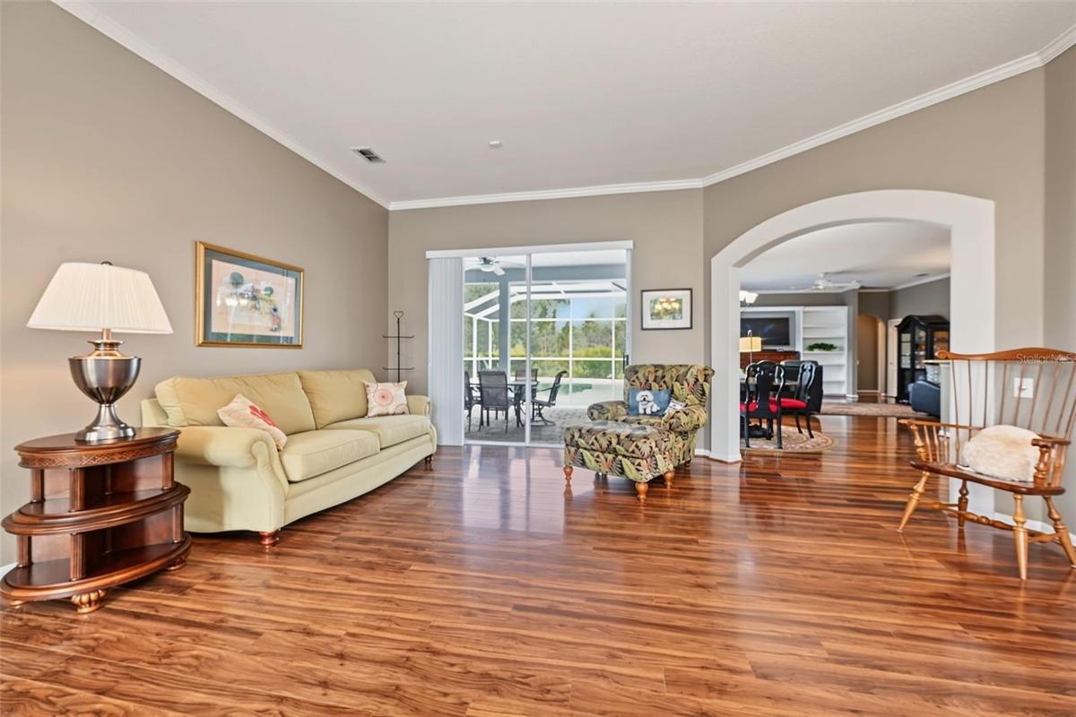 Formal living room with sliders to lanai/pool area