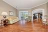 Formal living room with sliders to lanai/pool area