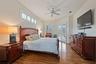 Primary Bedroom with sliders to lanai/pool area