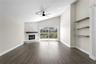 The spacious family room opens to the kitchen and additional living spaces, creating an ideal flow for everyday living and entertaining.