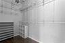 The primary bedroom's walk-in closet maximizes storage with high ceilings.