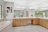 Fully redesigned chef’s kitchen with an expanded custom island, premium cabinetry, and finishes not offered by the original builder.