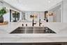 Alternate view of the custom sink with porcelain cover panels removed, revealing the full sink basin and functional design beneath.