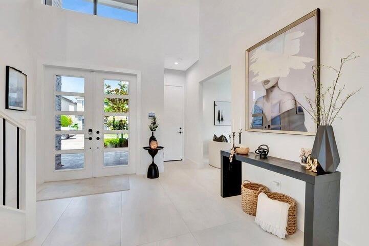 Alternate view highlighting the foyer’s open layout and architectural details.