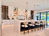 This premium kitchen, was completely removed then recreated with Italian porcelain and Designer appliances. It also has storage and way to many out ou