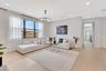 Wide-angle view of the upper-level loft emphasizing ceiling height, openness, and flexible use options.