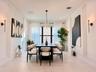 Alternate view highlighting the dining area’s open layout, natural light, and connection to the main living spaces.