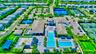 Aerial view highlighting the community layout, amenities, and surrounding landscape.