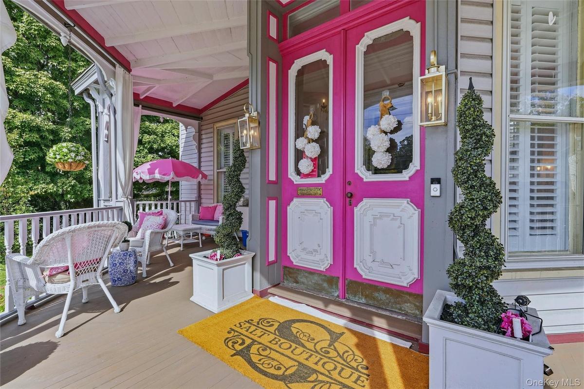 Covered front porch with wood flooring