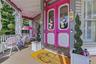 Covered front porch with wood flooring