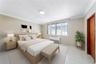 Primary Bedroom - This image has been virtually staged and does not reflect the current state of the property.