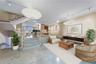Living and Dining Area - This image has been virtually staged and does not reflect the current state of the property.
