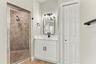 Linen closet in primary bathroom for additional storage