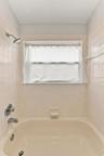 Upstairs hall bathroom features a tub/shower combo