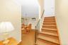 Stairs go up to bedroom