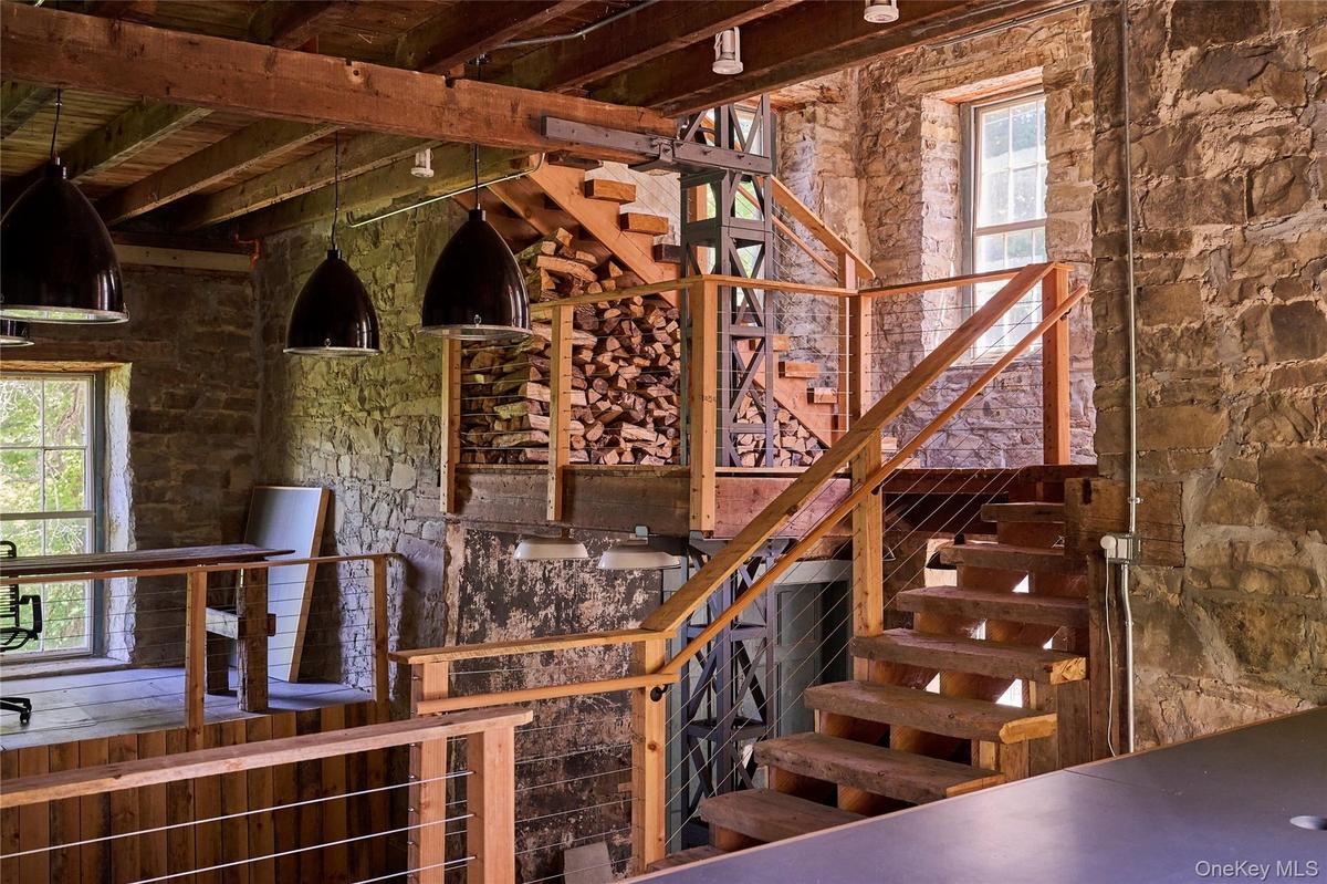 Stairway featuring plenty of natural light