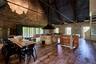 Dining space with hardwood / wood-style flooring, a high ceiling, and plenty of natural light